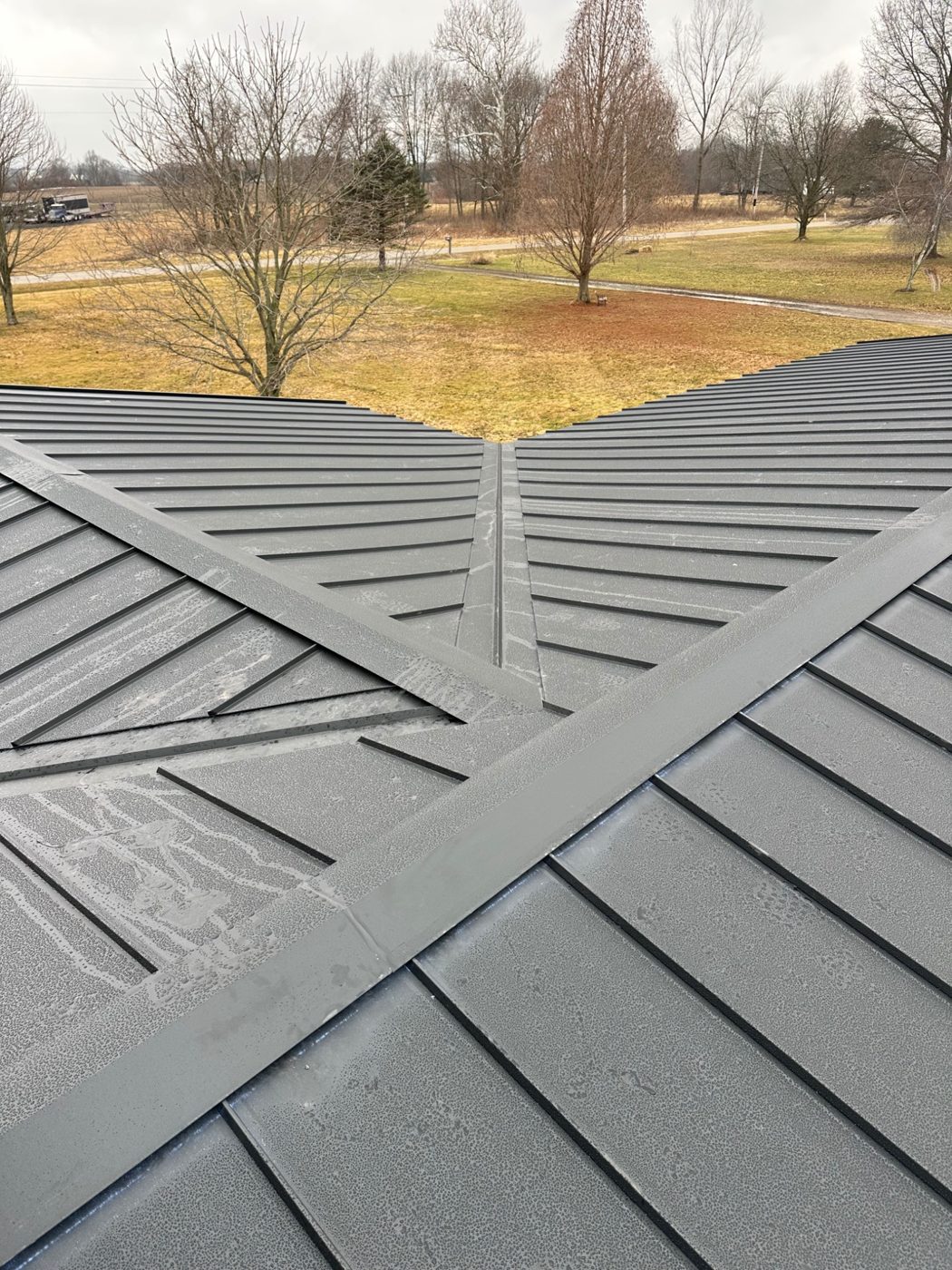 Finished metal roof on a stone home